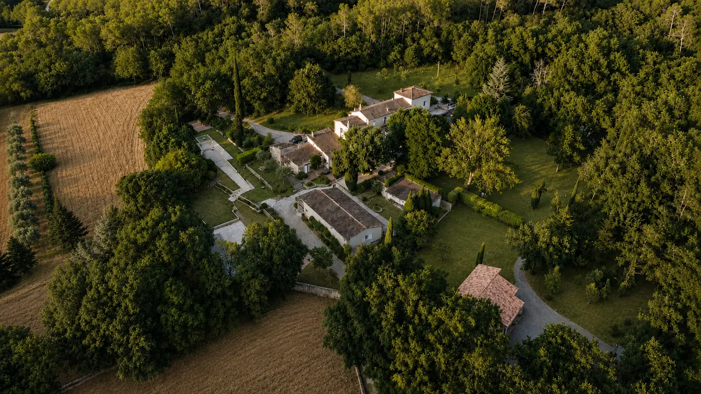 Aerial view of Le Mas de Fontbelle among woods, fields and olive trees